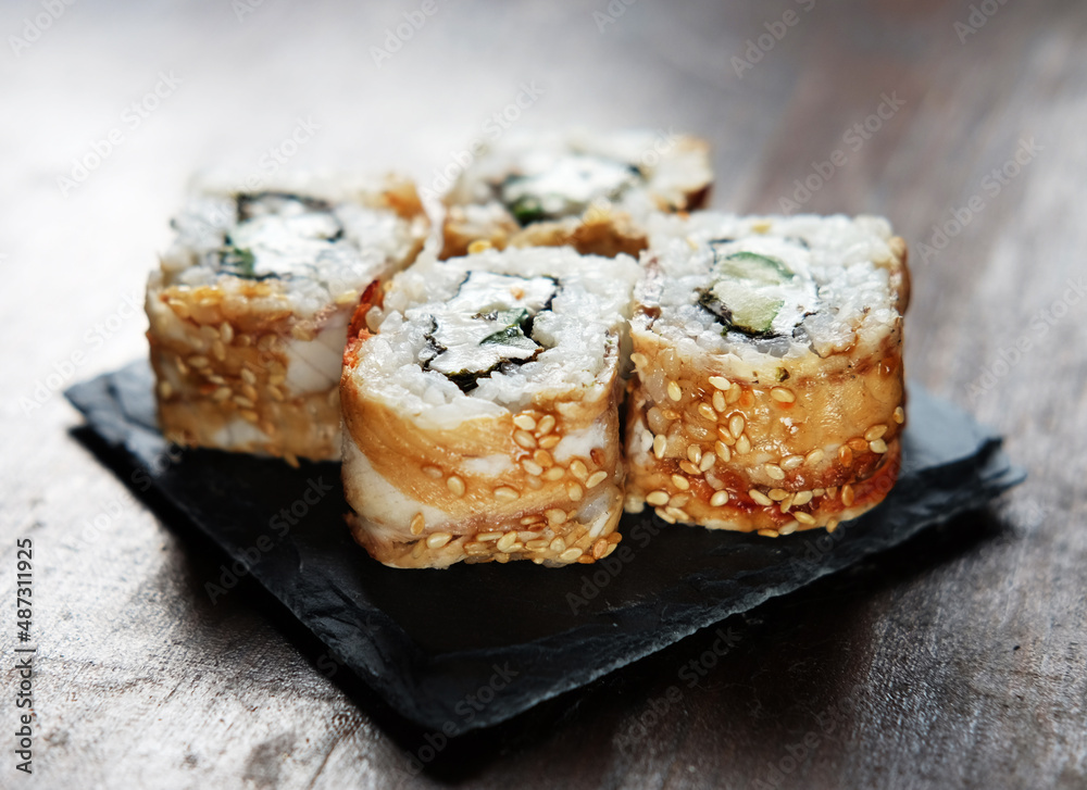 Japanese food rolls with fish and avocado. Japanese food rolls with fish and avocado.