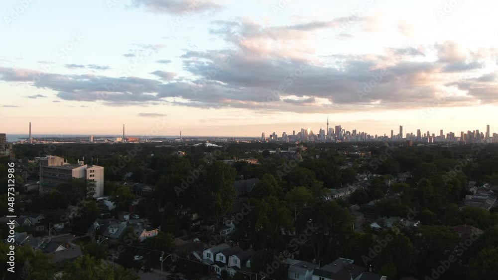Majestic city panorama of Toronto opens up when rising above the trees and households of Eastside district Majestic city panorama of Toronto opens up when rising above the trees and households of Eastside district