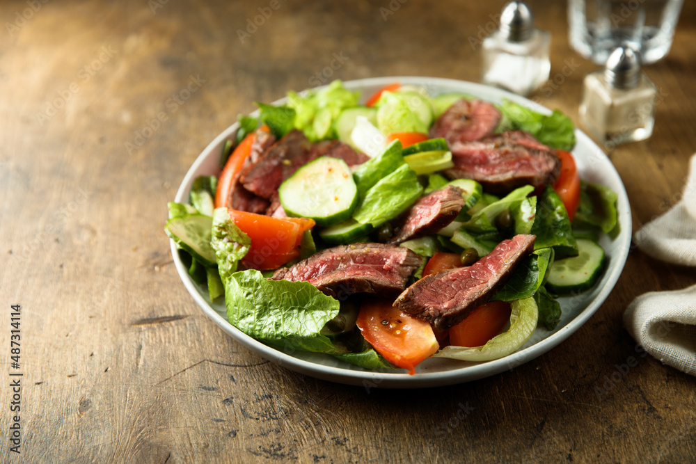 Fresh vegetable salad with beef steak