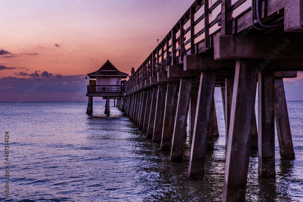 pier jetty at sunset in Naples, forida, usa pier jetty at sunset in Naples, forida, usa