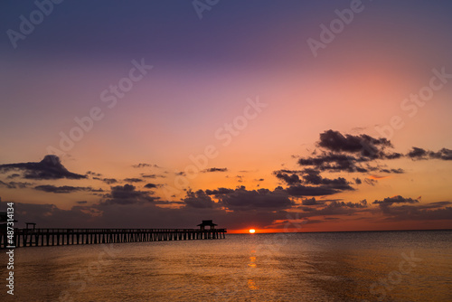 pier jetty at sunset in Naples, forida, usa photo