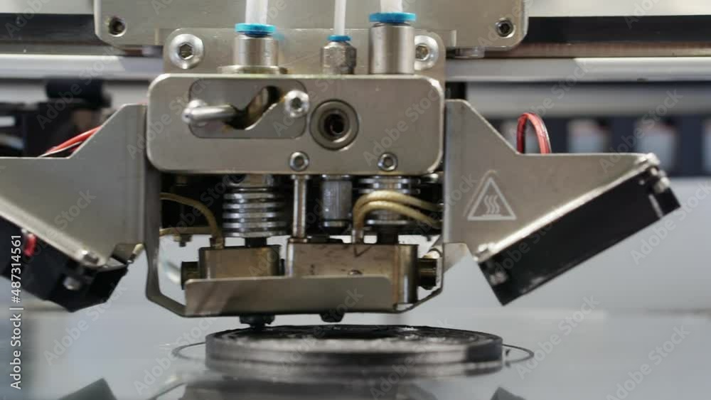 The 3D printer makes a figurine. The 3D printer makes a figurine.
