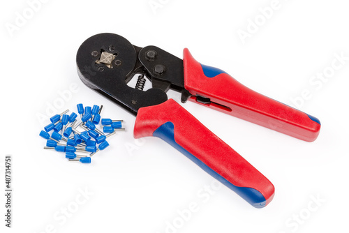 Crimping tool and heap of round crimp wire end terminals photo