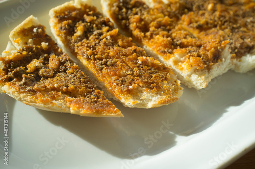 Sliced Iberian cachuela bread toast photo