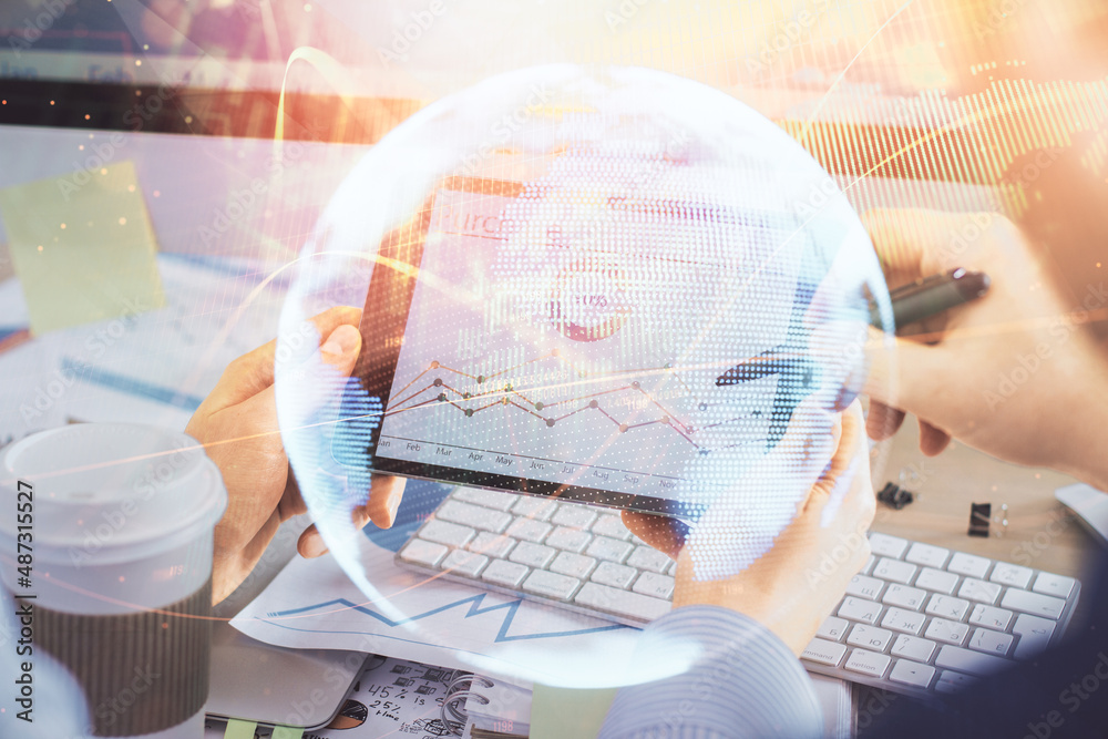 Double exposure of man's hands holding and using a phone and international business theme drawing.