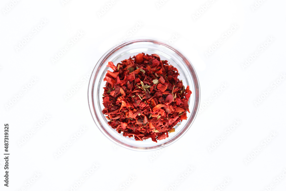 Series, spices on a white background, isolate, in different angles. Red, orange, bright pepper mix in a bowl Series, spices on a white background, isolate, in different angles. Red, orange, bright pepper mix in a bowl