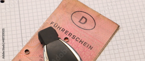 an old german driver's license with the word "driver's license" and a car key 