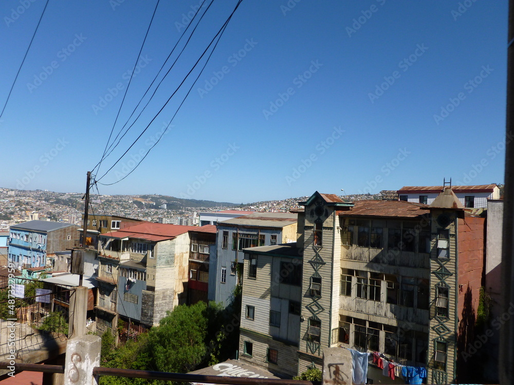 Photograph taken on a sunny day around Valparaiso City at Chili, showing the architecture and colours of this historical city. Streets, markets and the famous elevators.