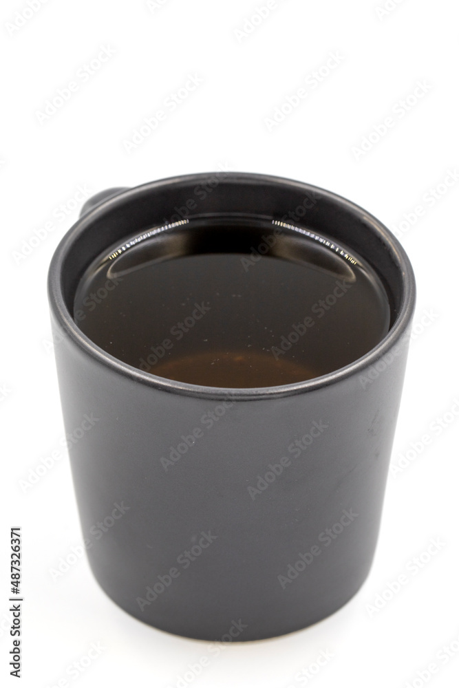 Winter Herbal tea isolated on a white background. Linden tea. immune-boosting herbal tea. Medicinal tea prepared from linden leaves, Clove particles and Chamomile. Winter Herbal tea isolated on a white background. Linden tea. immune-boosting herbal tea. Medicinal tea prepared from linden leaves, Clove particles and Chamomile.