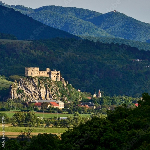 Beckov Slovak Castle in the background with the protruding Tematin Castle and the surrounding spring nature during the sunny evening photo