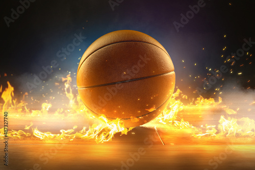Basketball on wooden floor in between fire photo