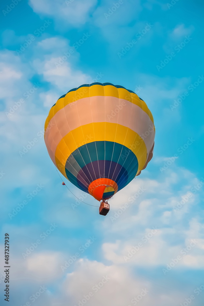 Balloon on the background of blue sky with white clouds in summer Balloon on the background of blue sky with white clouds in summer