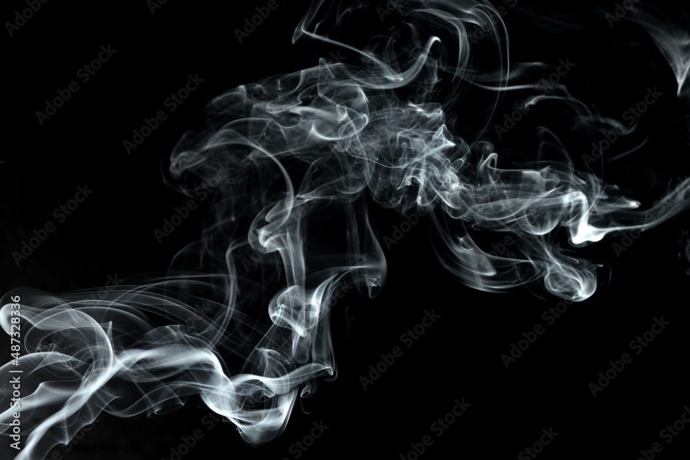Twisted plumes of smoke, smoke movement on a black background. Abstract smoke lines Twisted plumes of smoke, smoke movement on a black background. Abstract smoke lines