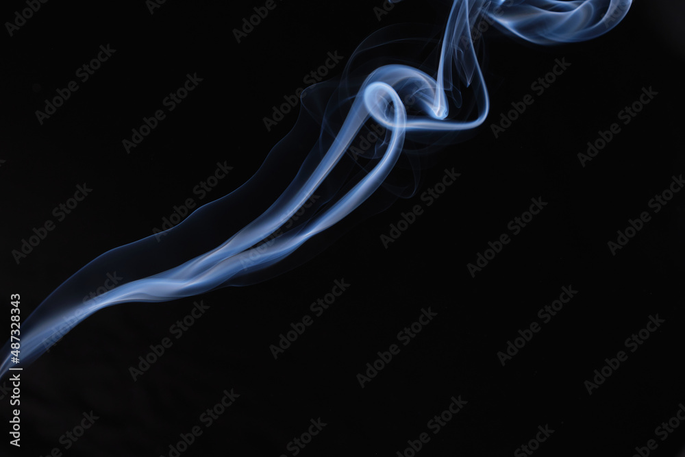 Twisted plumes of smoke, smoke movement on a black background. Abstract smoke lines Twisted plumes of smoke, smoke movement on a black background. Abstract smoke lines