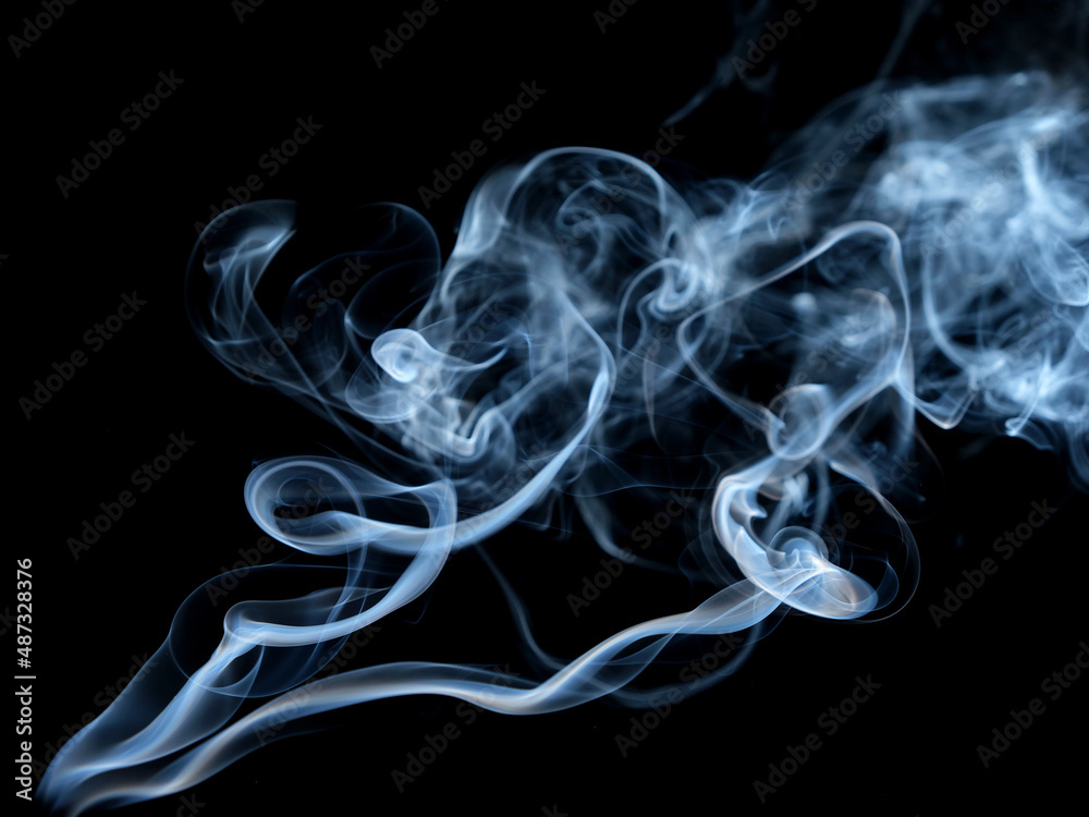 Twisted plumes of smoke, smoke movement on a black background. Abstract smoke lines Twisted plumes of smoke, smoke movement on a black background. Abstract smoke lines