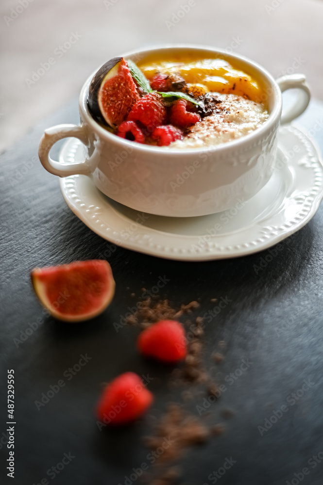 Breakfast oat porridge with berries and mango jam Breakfast oat porridge with berries and mango jam