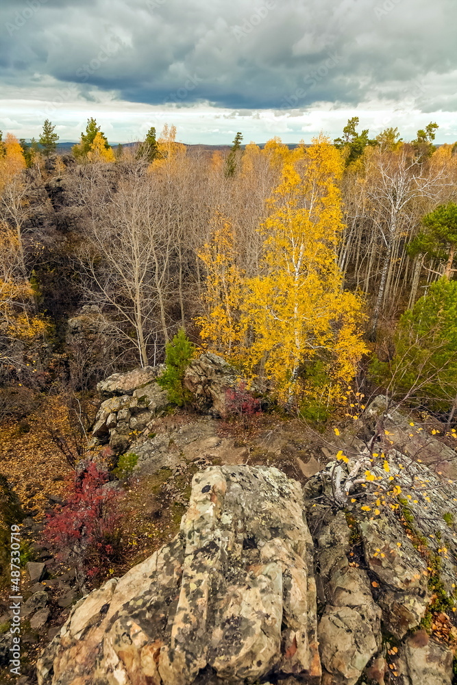 Autumn landscape with rocks, trees and sky with clouds Autumn landscape with rocks, trees and sky with clouds