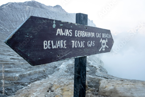 Hazardous warning sign gas-Beware of toxic gas on the edge of volcano crater with acid fumes