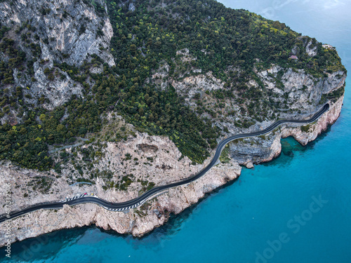 Aerial view of Aurelia street in Noli, Capo Noli and Varigotti, province of Savona. Drone photography from above of snake street snake in Liguria, north Italy, near Bergeggi and Spotorno. photo