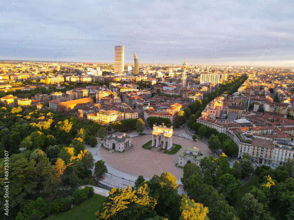 Aerial view of Arco della Pace in Milano, north Italy. Drone photography of Arch of Peace in Piazza Sempione, near Sempione park in the heart of Milan, Lombardy and Sforza Castle.