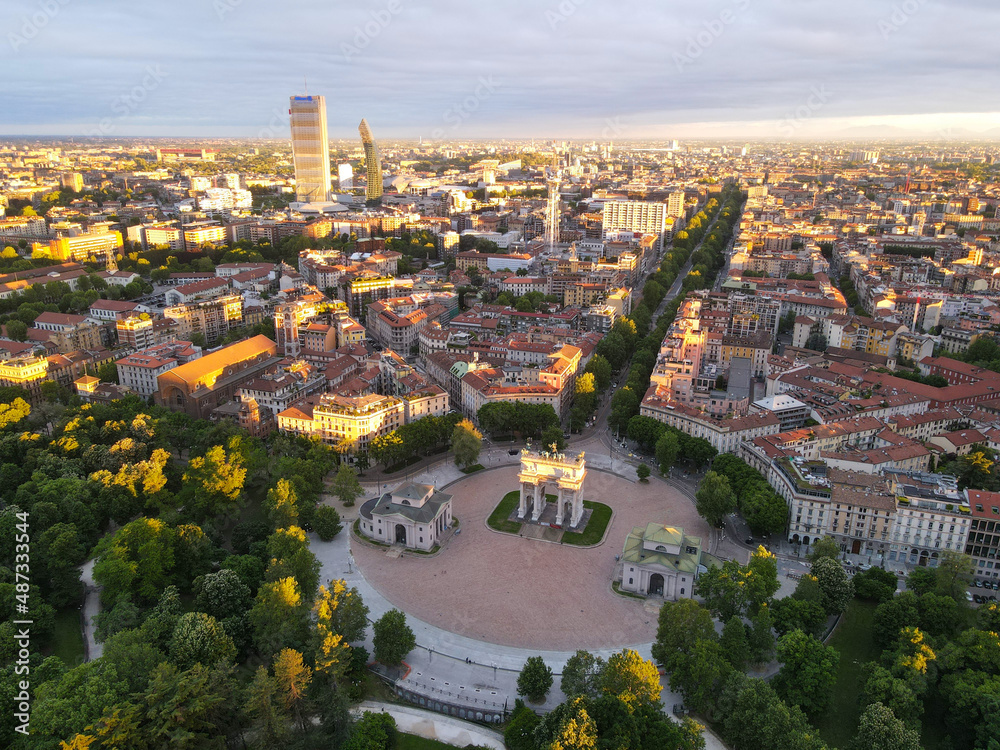 Fototapeta premium Aerial view of Arco della Pace in Milano, north Italy. Drone photography of Arch of Peace in Piazza Sempione, near Sempione park in the heart of Milan, Lombardy and Sforza Castle.