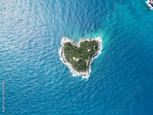 Aerial view of Bergeggi island, heart island from above, in Liguria, north Italy. Drone photography of the Ligurian coast, province of Savona with Spotorno and the island of Bergeggi.