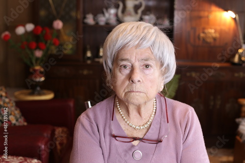 Canvas Print Disappointed senior woman at home