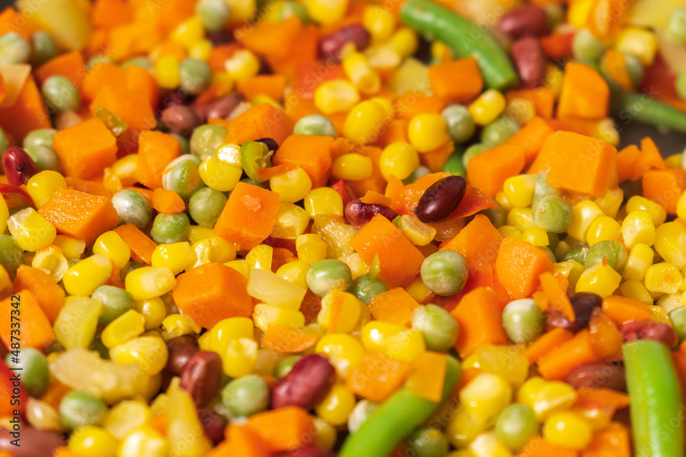 Cooking vegetables of corn, peas, peppers, beans close-up. Selective focus Cooking vegetables of corn, peas, peppers, beans close-up. Selective focus