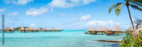 Summer vacation in an overwater bungalow at a luxury beach resort