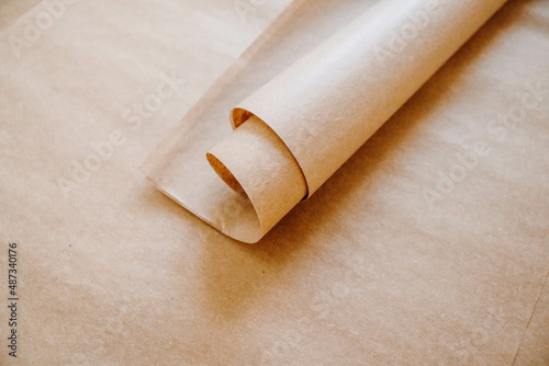 Obraz na plátně Brown wrapping tissue paper on a brown paper background for art studios