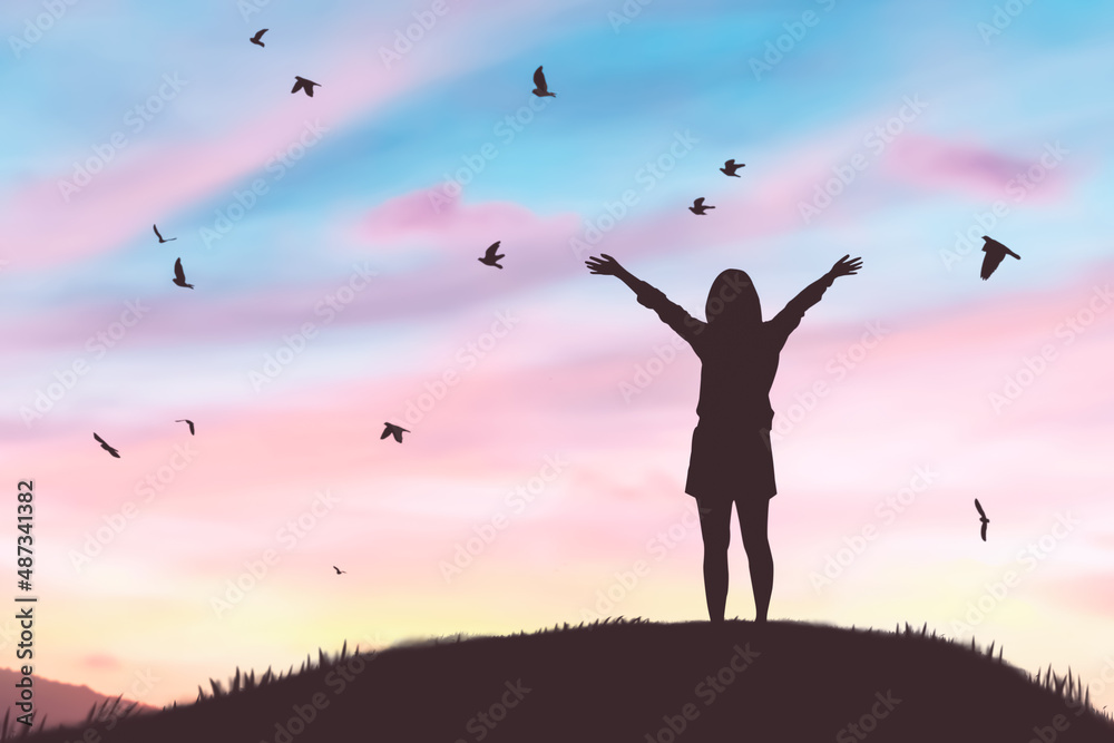 Woman rising hands and birds flying on sunset sky at nature field abstract background. Freedom feel good and travel adventure concept. Woman rising hands and birds flying on sunset sky at nature field abstract background. Freedom feel good and travel adventure concept.