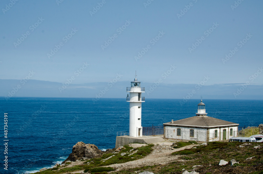 Lighthouse on ocean coastline 