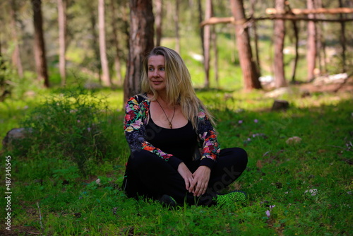 woman sitting on the grass