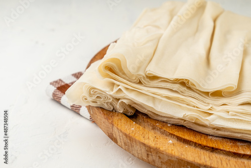 Phyllo dough close-up on a white table.