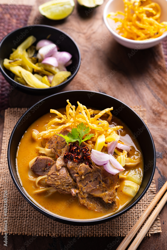 Northern Thai food (Khao Soi), Spicy curry noodles soup with coconut milk and beef, Local Thai food