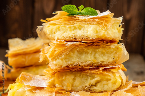 Sweet filo pastry with cream filling. Close-up. photo