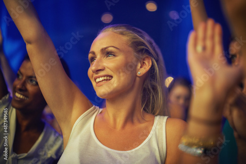 This is amazing. A pretty blond teen watching her favourite band perform live.