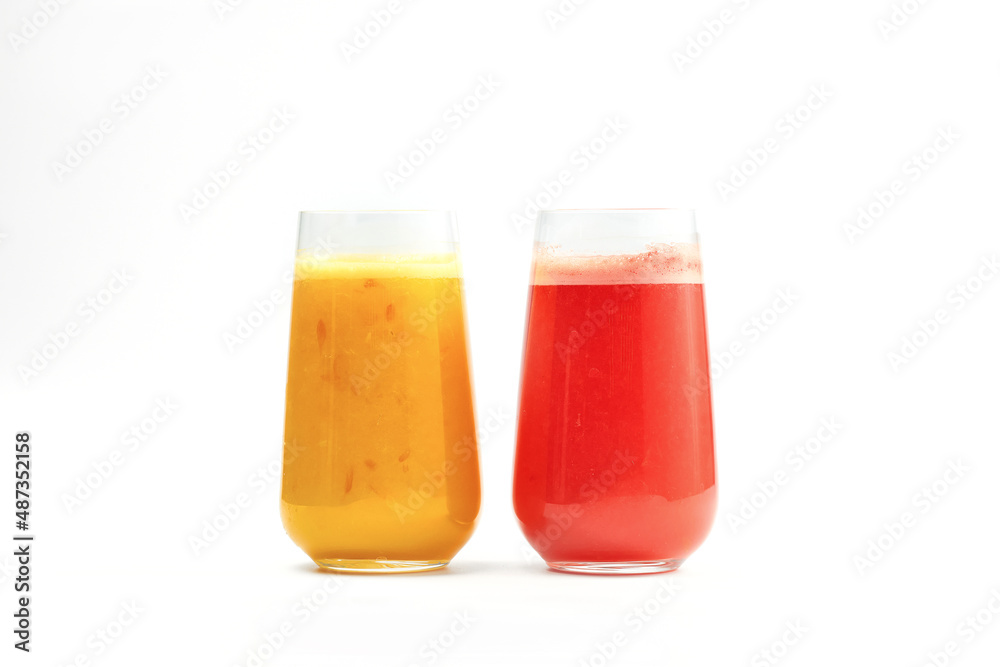 Three freshly squeezed juices: orange, grapefruit in glasses isolated on a white background Three freshly squeezed juices: orange, grapefruit in glasses isolated on a white background