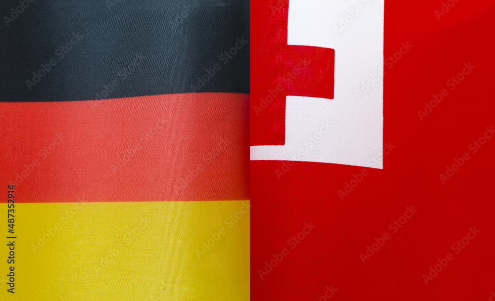 Fototapeta premium fragments of the national flags of Germany and Tonga in close-up