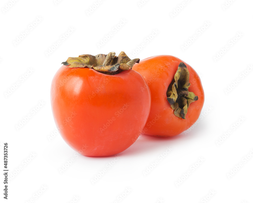 Persimmons isolated. Fresh orange persimmons on white background. Persimmons isolated. Fresh orange persimmons on white background.