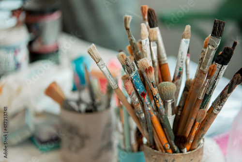 Tools of the artist-restorer, in the jars there are brushes of different sizes