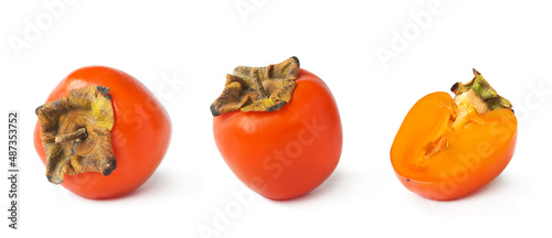 Persimmons isolated. Fresh orange persimmons on a white background. Whole and sliced persimmons.