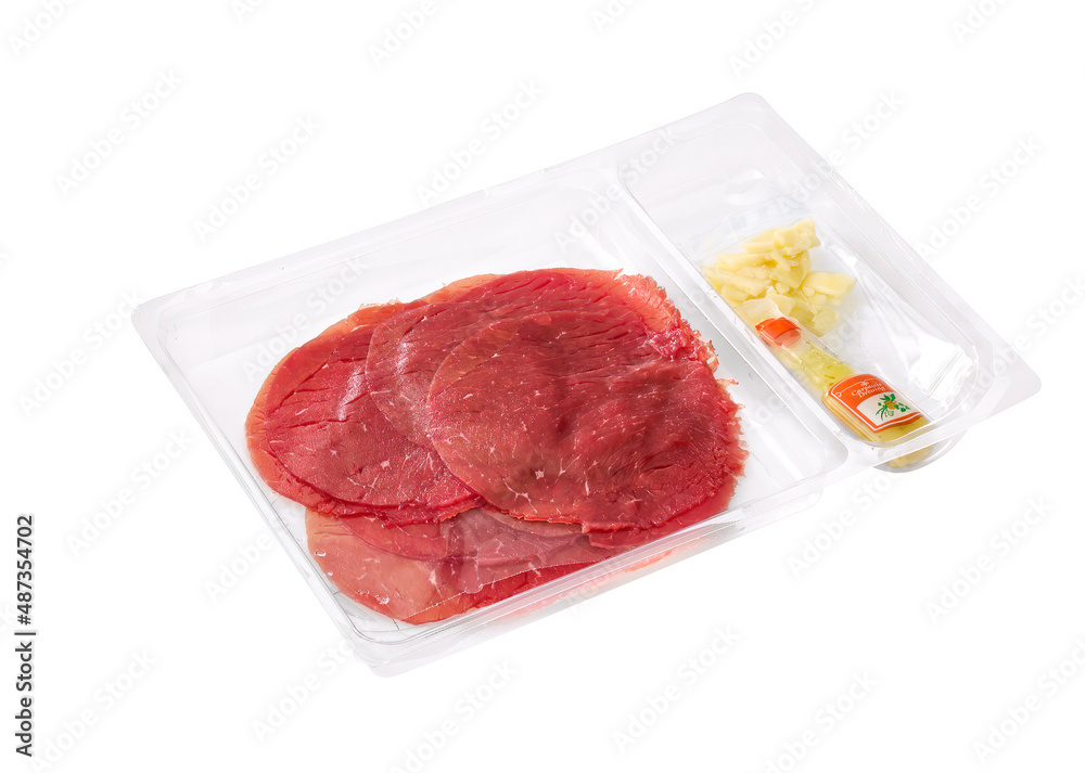 Carpaccio with oil and cheese in plastic packaging