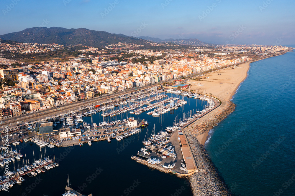 Aerial drone view of El Masnou and Mediterranean sea on sunny winter day, Catalonia, Spain