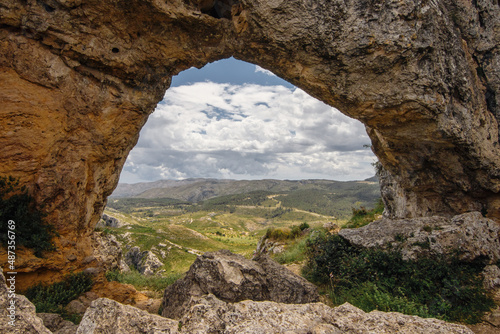 Rock arch La Forada or Foradada above the Vall de Gallinera, Alicante province, Spain