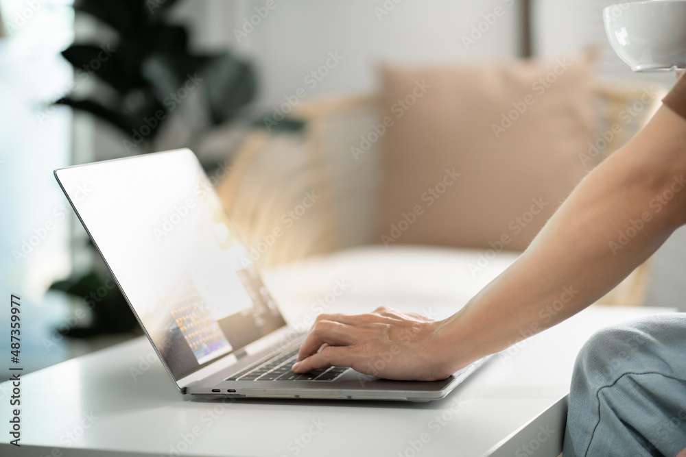 Fototapeta premium Man work from home. work online on laptop. Asian businessman working online business concept with social distancing laptop online meeting.