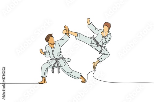 Single continuous line drawing of young confident karateka man in kimono practicing karate combat at dojo. Martial art sport training concept. Trendy one line draw design vector graphic illustration