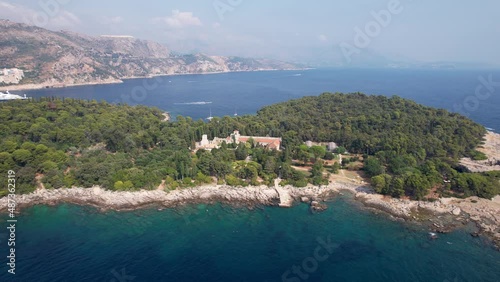 Aerial Orbit Benediktinski Samostan Monastery Lokrum Island Dubrovnik Croatia Turquoise Teal Waters of Adriatic Sea Hazy Summer Day Drone 4k photo