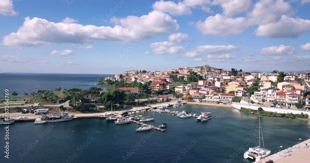 Aerial video of a scenic resort town Neos Marmaras with yacht marina sea port in Halkidiki, Sithonia. Travel attractions and vacation in Greece Aerial video of a scenic resort town Neos Marmaras with yacht marina sea port in Halkidiki, Sithonia. Travel attractions and vacation in Greece