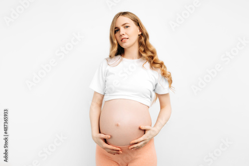 Pregnant happy woman touches her belly. Pregnant mom caressing her belly and smiling close up. Healthy pregnancy concept Free Download Pregnant happy woman touches her belly. Pregnant mom caressing her belly and smiling close up. Healthy pregnancy concept - GFXLoad